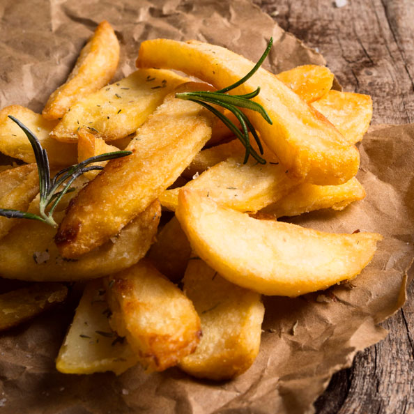 high angle salted french fries with herbs 1